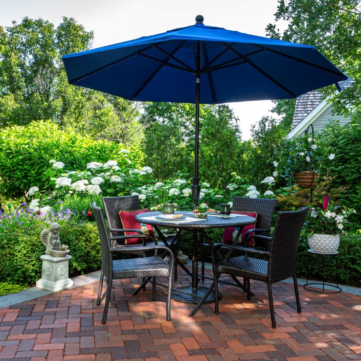 Outdoor patio at dusk — Green Grass's Organic Mosquito Barrier in action, allowing comfortable evening use.