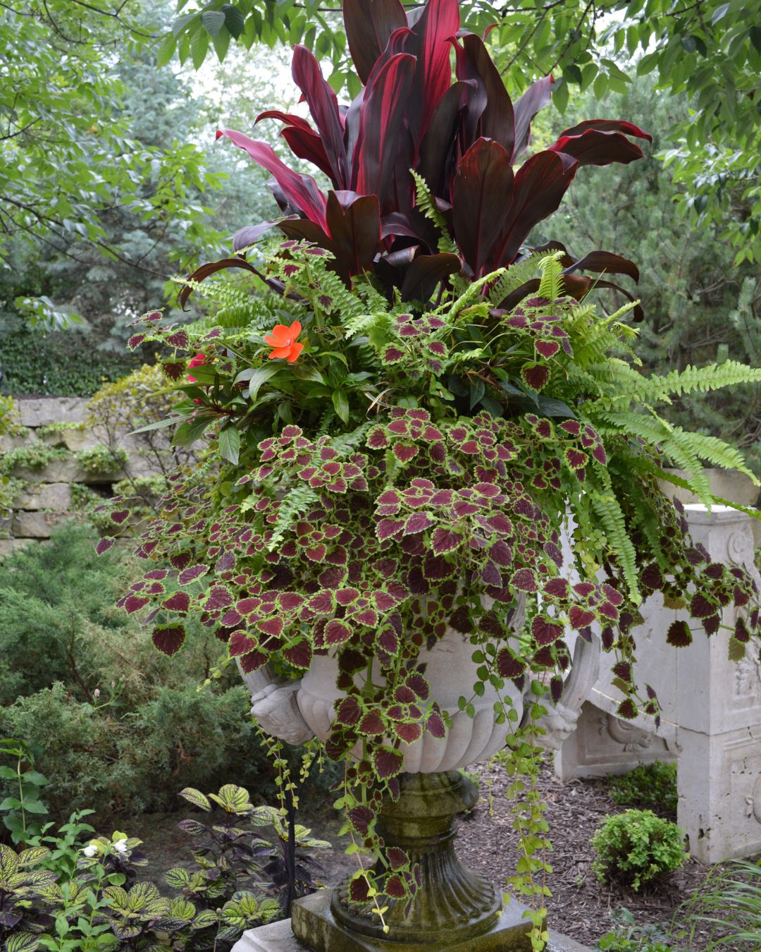 Custom summer annual arrangement — Green Grass's white-glove floral design for porches, poolsides, and walkways.